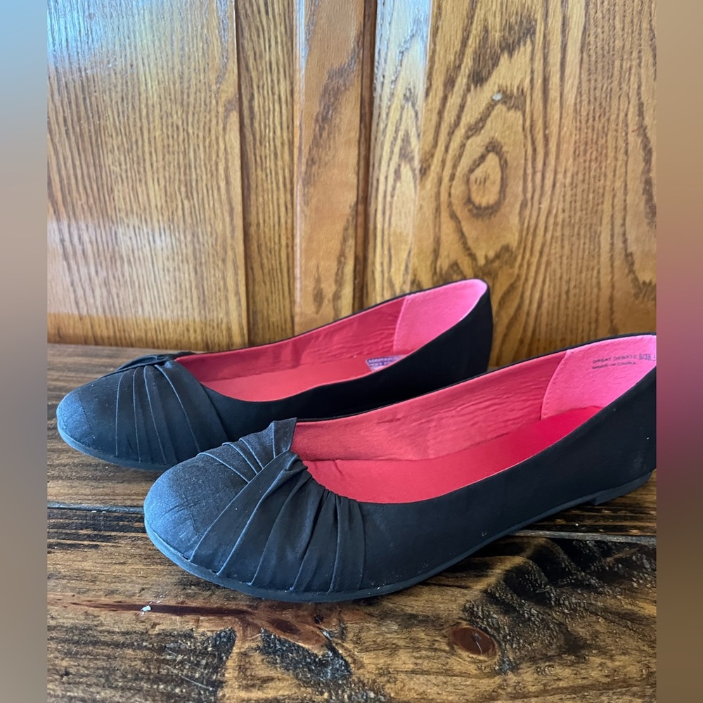 Woman’s black flat shoes